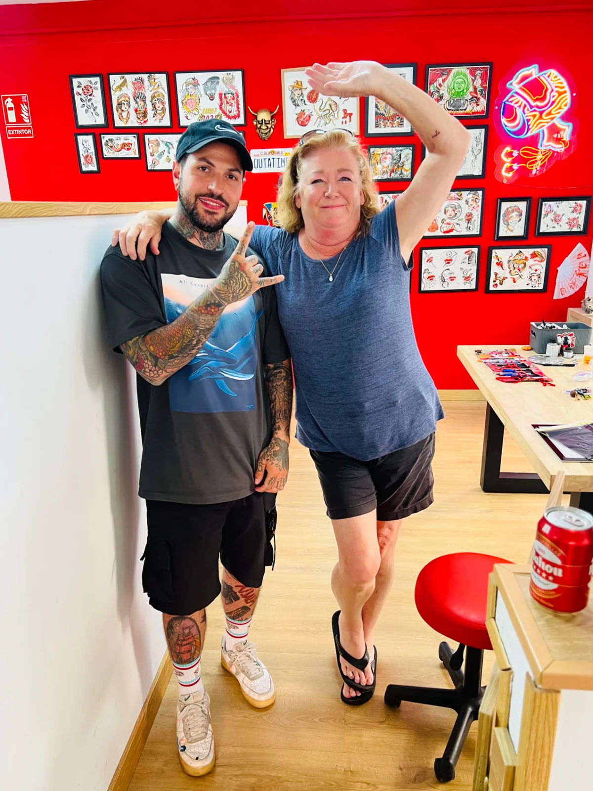 Mary with a tattoo artist they met on the Camino